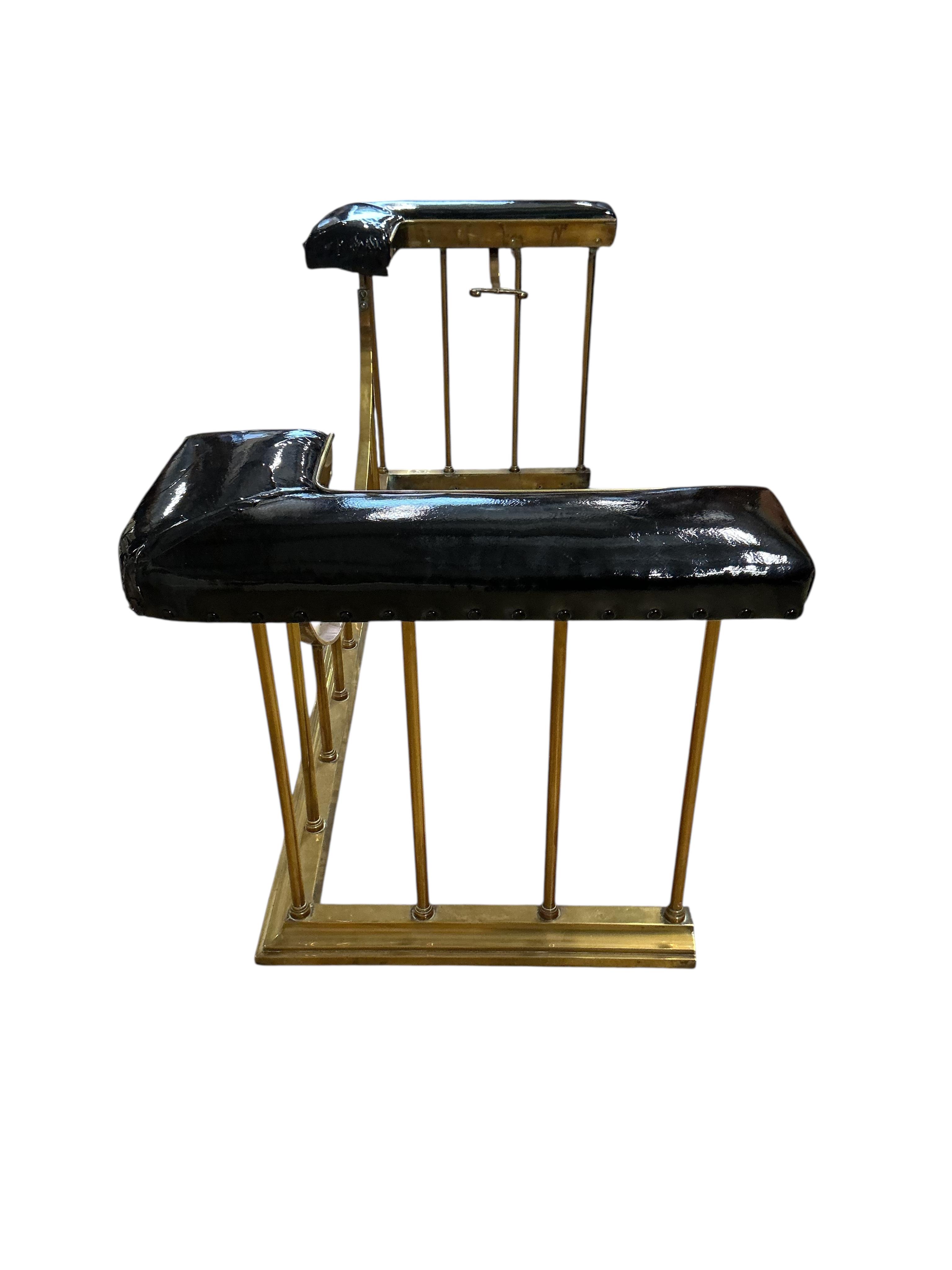 A late Victorian brass club fender, in need of re-upholstering, width 160cm, depth 60cm, height 59cm